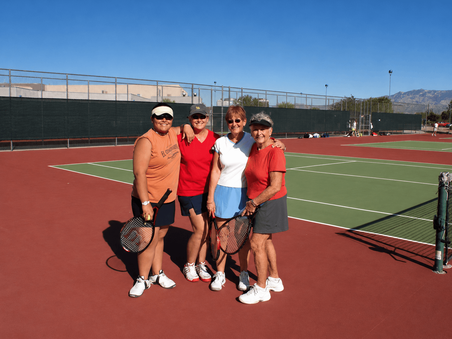 Community tennis group after a clinic