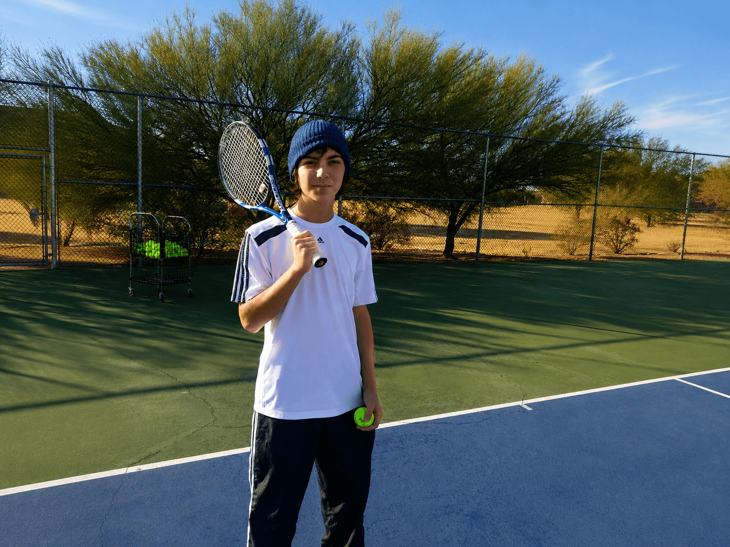 Junior tennis player with racquet