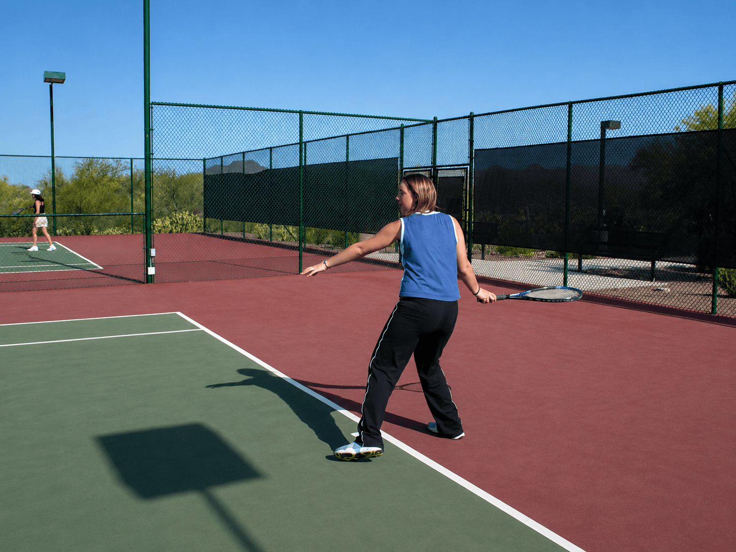 High school tennis players at the net